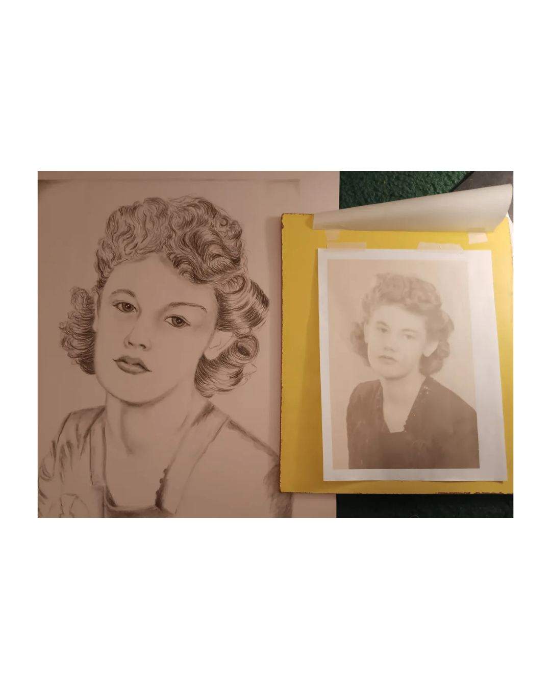 A charcoal portrait of a woman with curled hair, beside a small reference photograph attached to a yellow backing.