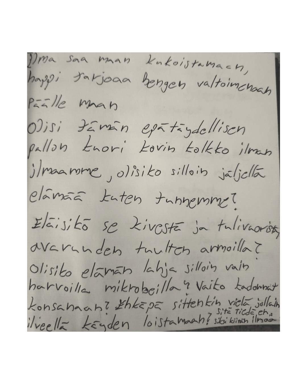 A photographed handwritten Finnish poem about air and life.